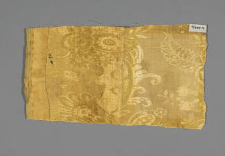 Yellow lampas gown fragment
