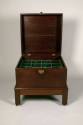 Bottle case with bottles and stoppers,
Phillip Bell (Maker), 
c. 1760,
Mahogany, spruce, bra ...